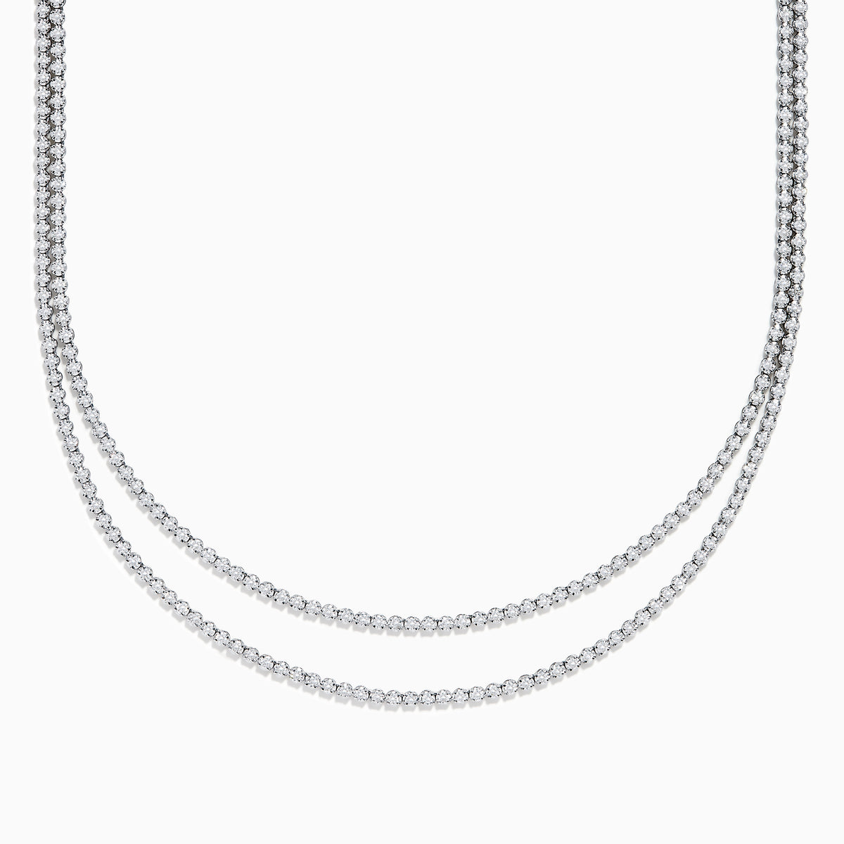 Two elegant Pave Classica 14K White Gold Diamond Tennis Necklaces with closely set, sparkling diamonds are layered together against a white background, forming gentle, symmetrical curves.