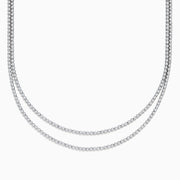 Two elegant Pave Classica 14K White Gold Diamond Tennis Necklaces with closely set, sparkling diamonds are layered together against a white background, forming gentle, symmetrical curves.