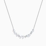 The Lab Grown Multi Shape Diamond Collarbone Necklace in 14K White Gold features a row of marquise and round lab grown diamonds arranged in a graceful curve along the center of the chain.