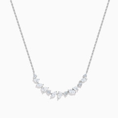 The Lab Grown Multi Shape Diamond Collarbone Necklace in 14K White Gold features a row of marquise and round lab grown diamonds arranged in a graceful curve along the center of the chain.