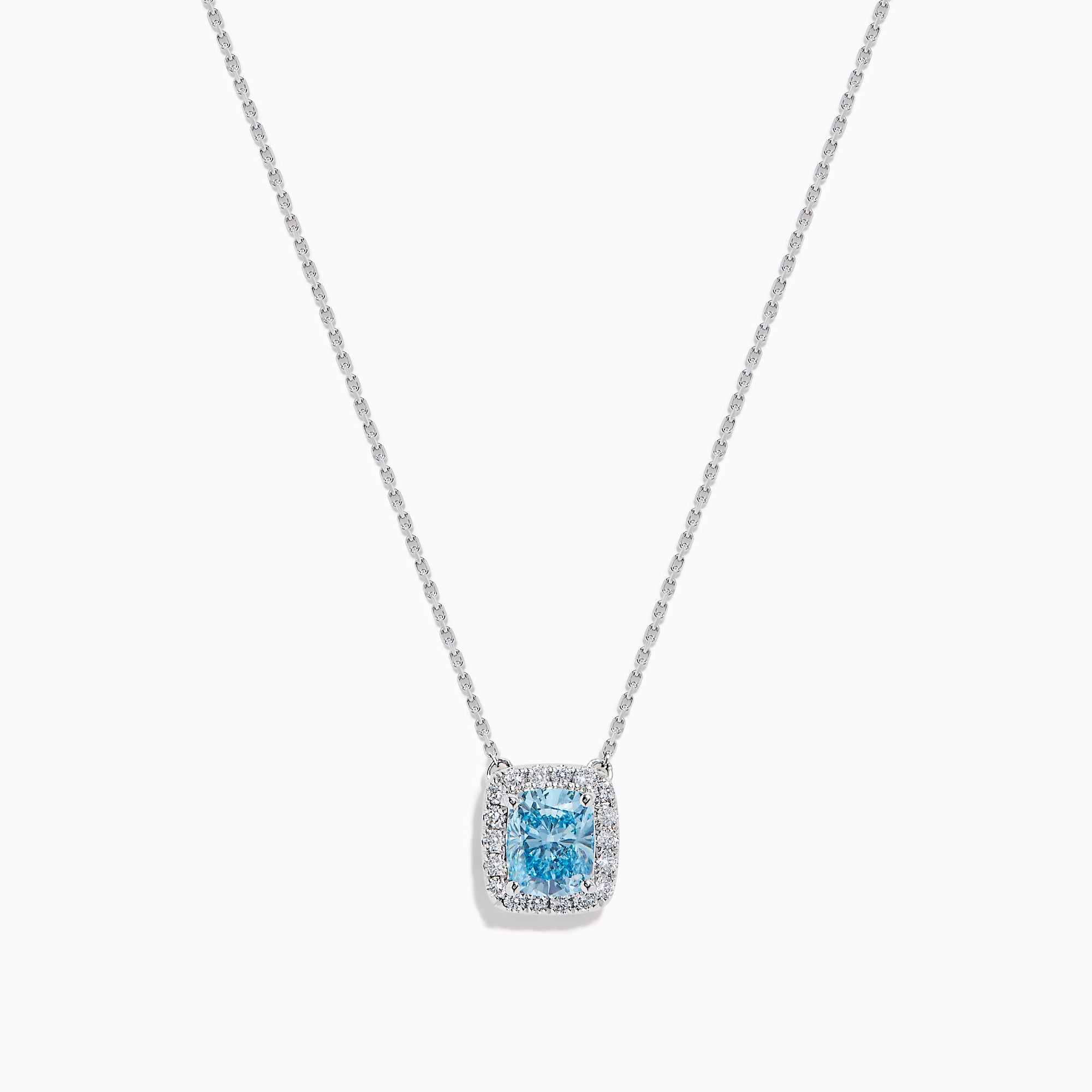 The Lab Grown Blue and White Diamond Halo Necklace in 14K White Gold features a square blue and white diamond pendant surrounded by clear stones, elegantly displayed against a white background.