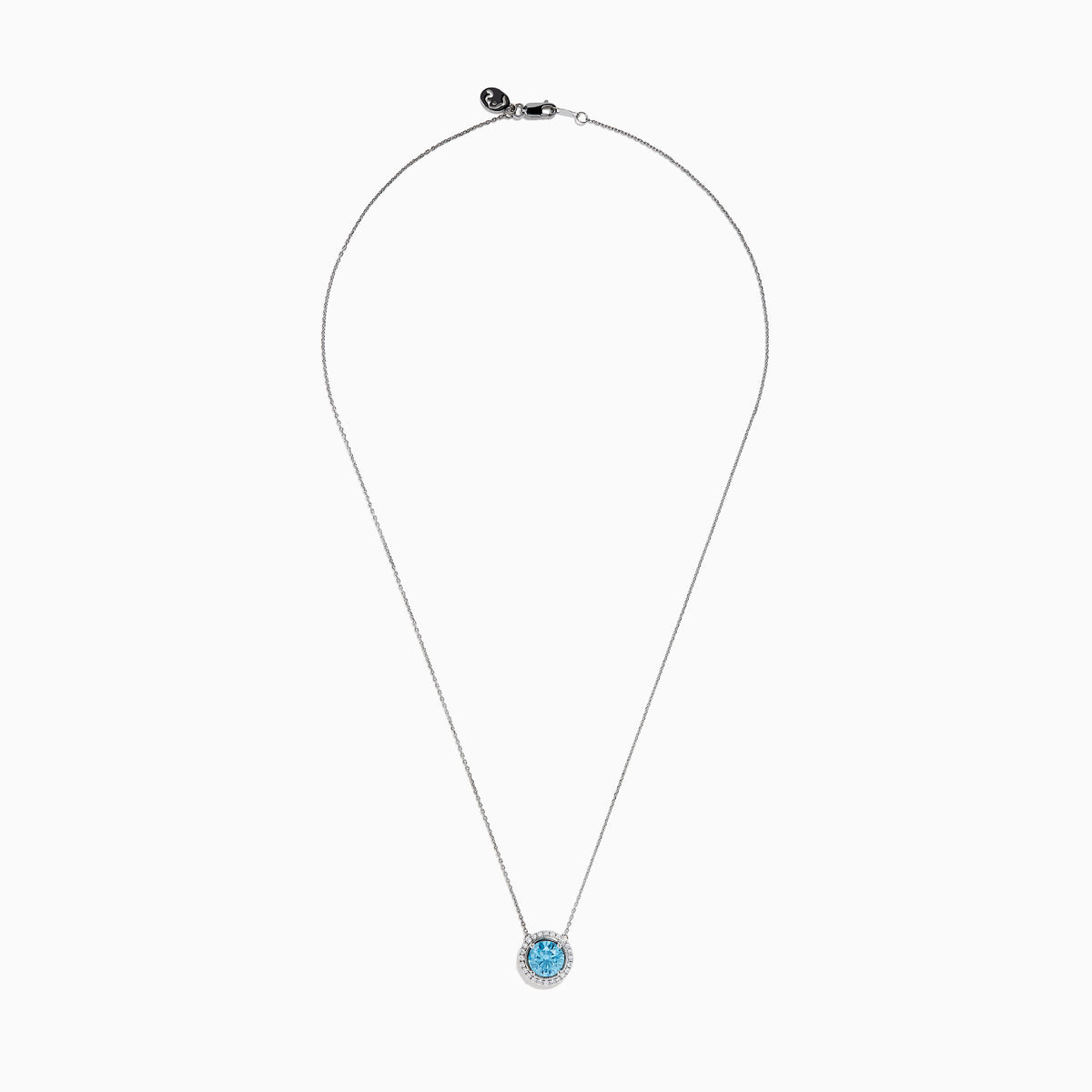 The Lab Grown Blue and White Diamond Halo Necklace in 14K White Gold features a round blue gemstone pendant encircled by sparkling lab grown diamonds, shown against a white background.