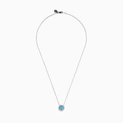The Lab Grown Blue and White Diamond Halo Necklace in 14K White Gold features a round blue gemstone pendant encircled by sparkling lab grown diamonds, shown against a white background.