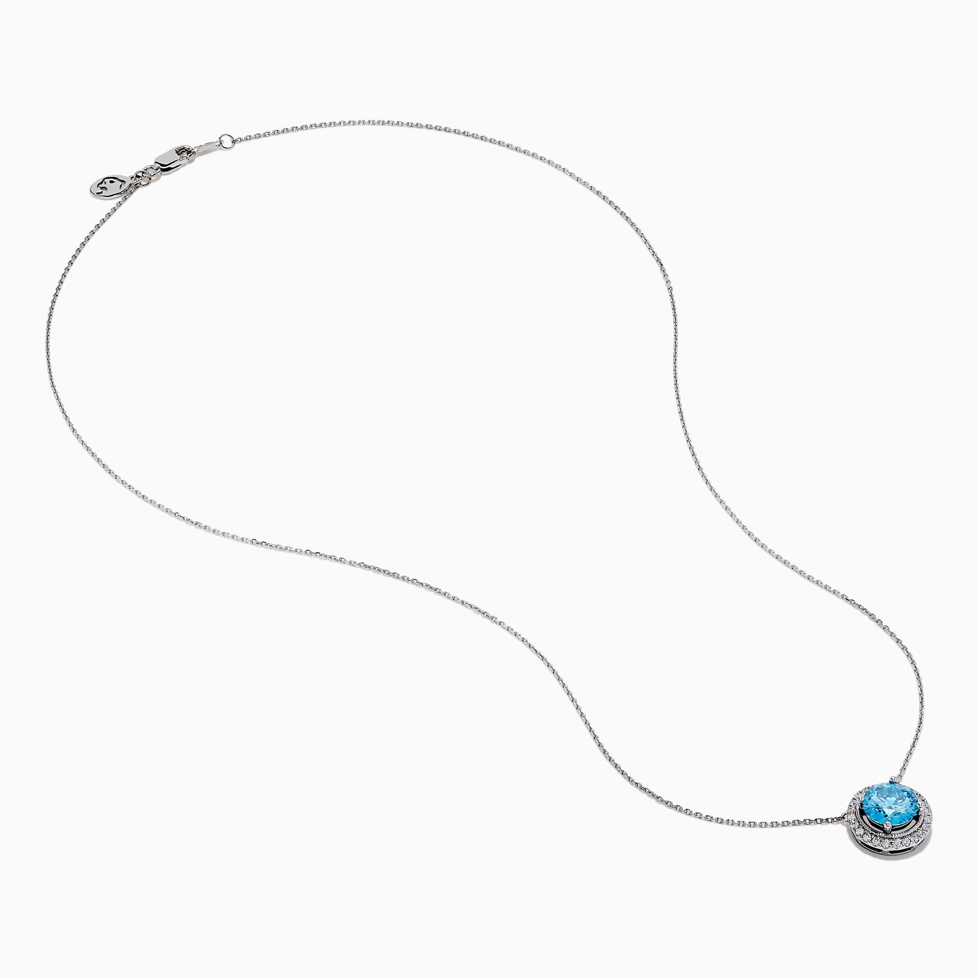 The Lab Grown Blue and White Diamond Halo Necklace in 14K White Gold features a round blue gemstone pendant encircled by sparkling lab grown diamonds, shown against a white background.
