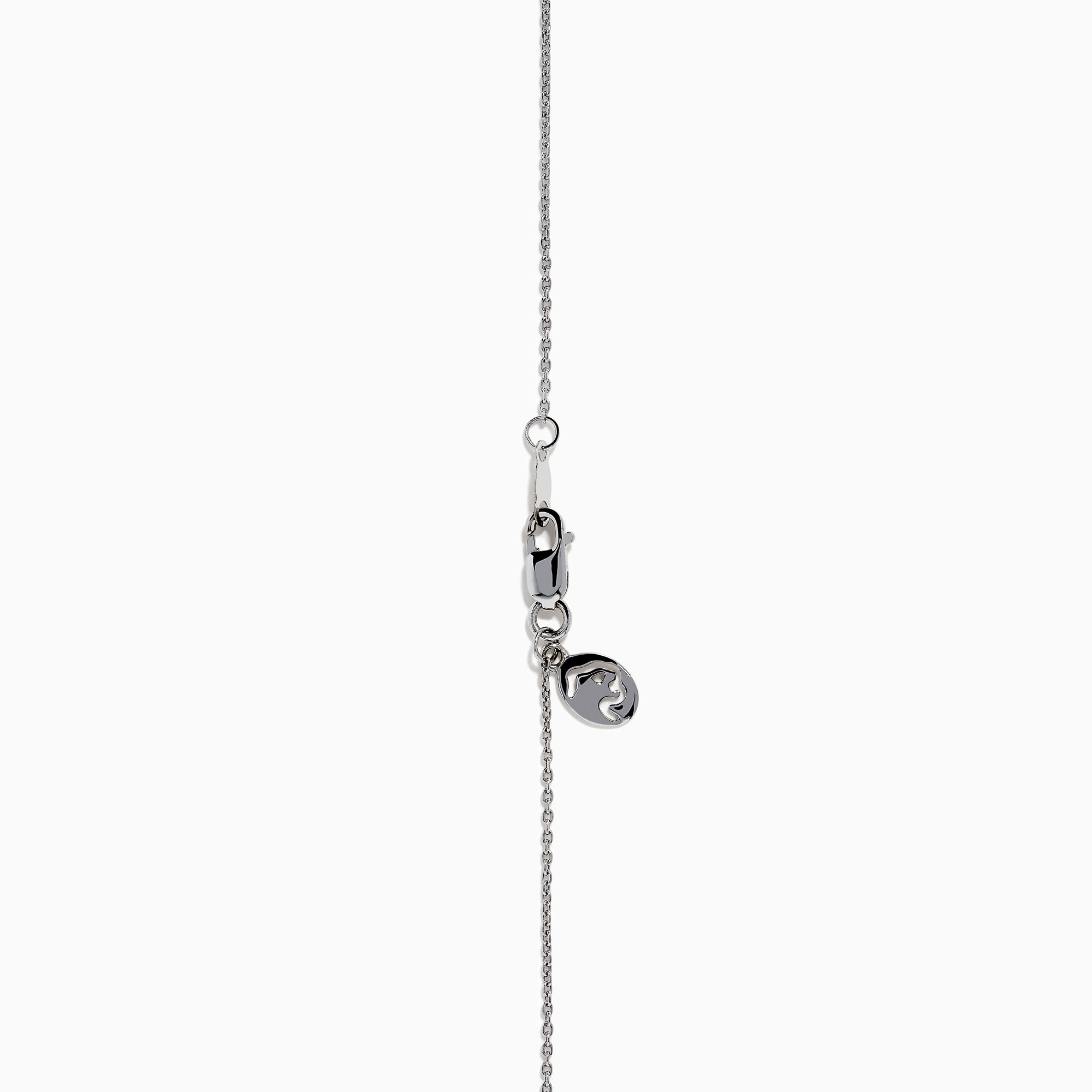 The Lab Grown Blue and White Diamond Halo Necklace in 14K White Gold features a round blue gemstone pendant encircled by sparkling lab grown diamonds, shown against a white background.