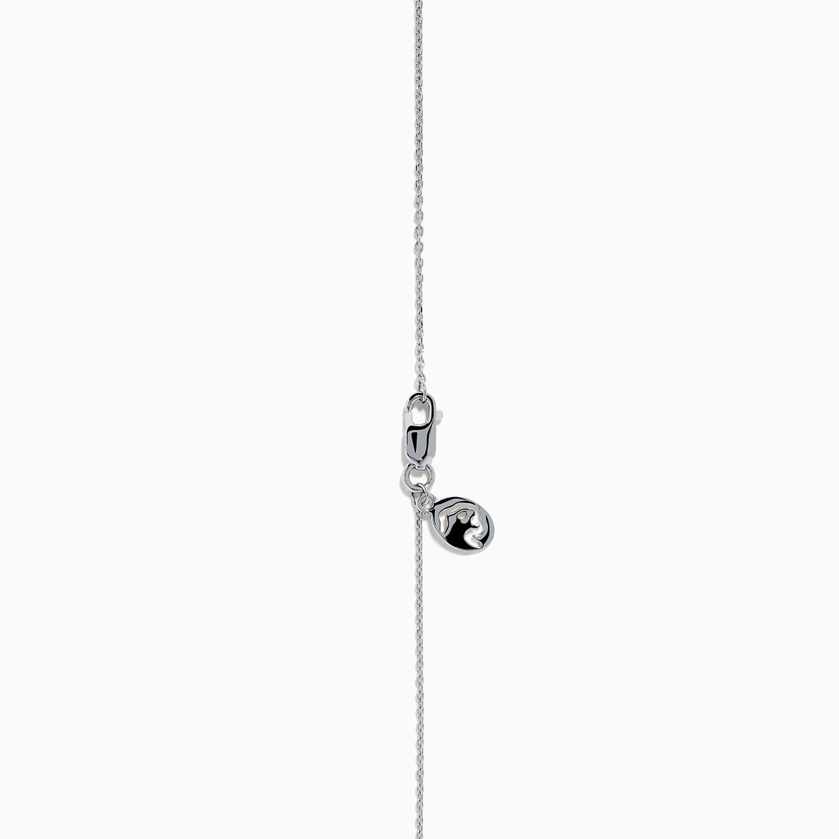 The Lab Grown Blue and White Diamond Halo Necklace in 14K White Gold features a round blue gemstone pendant surrounded by lab grown diamonds, plus two small clear stones set along the chain.
