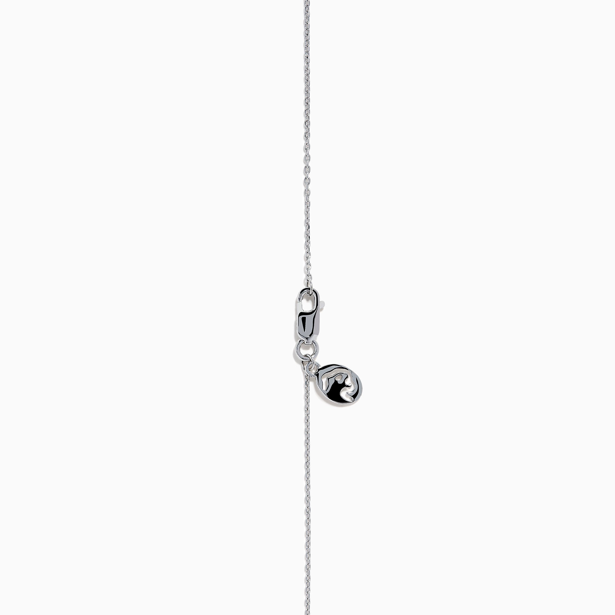 The Lab Grown Blue and White Diamond Halo Necklace in 14K White Gold features a round blue gemstone pendant surrounded by lab grown diamonds, plus two small clear stones set along the chain.