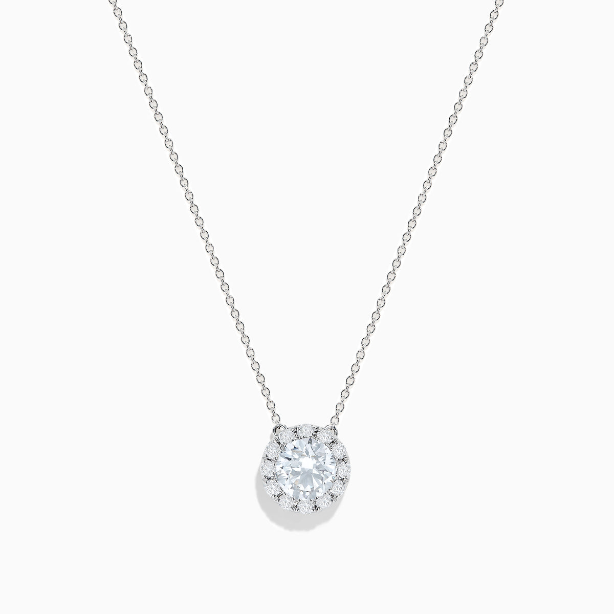 The 14K White Gold Lab Grown Diamond Pendant features a delicate silver chain and a round, sparkling lab grown diamond in an elegant white gold setting, shown against a white background.