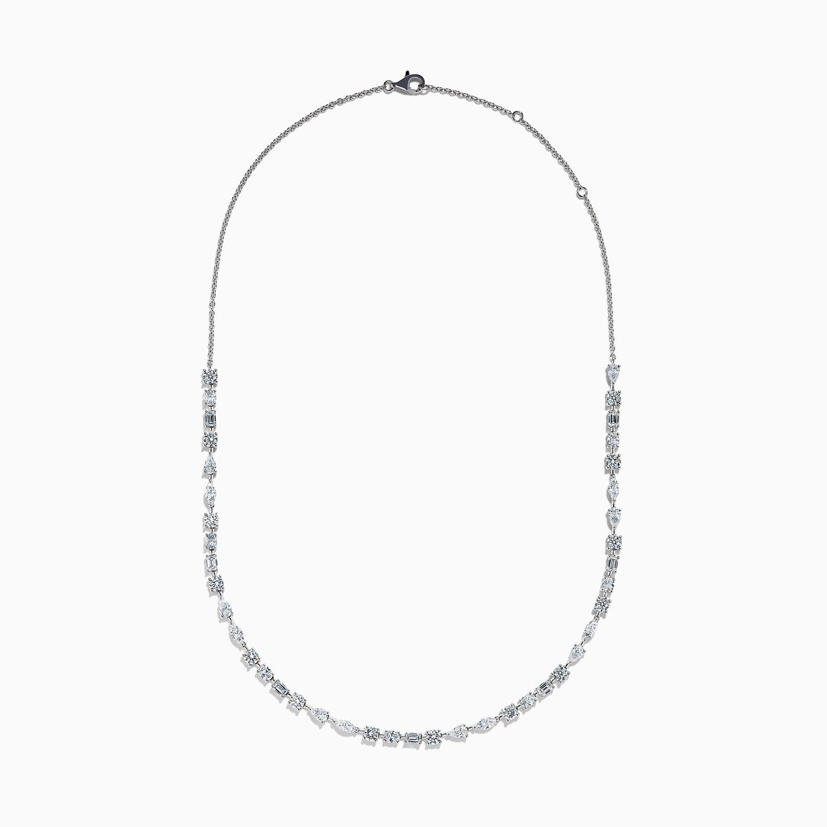The Lab Grown Multi Shape Diamond 7.25ct Tennis Necklace in 14K White Gold features round, marquise, and emerald cut lab-grown diamonds arranged evenly along the chain and is shown gracefully curved on a white background.