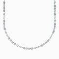 The Lab Grown Multi Shape Diamond 7.25ct Tennis Necklace in 14K White Gold features round, marquise, and emerald cut lab-grown diamonds arranged evenly along the chain and is shown gracefully curved on a white background.