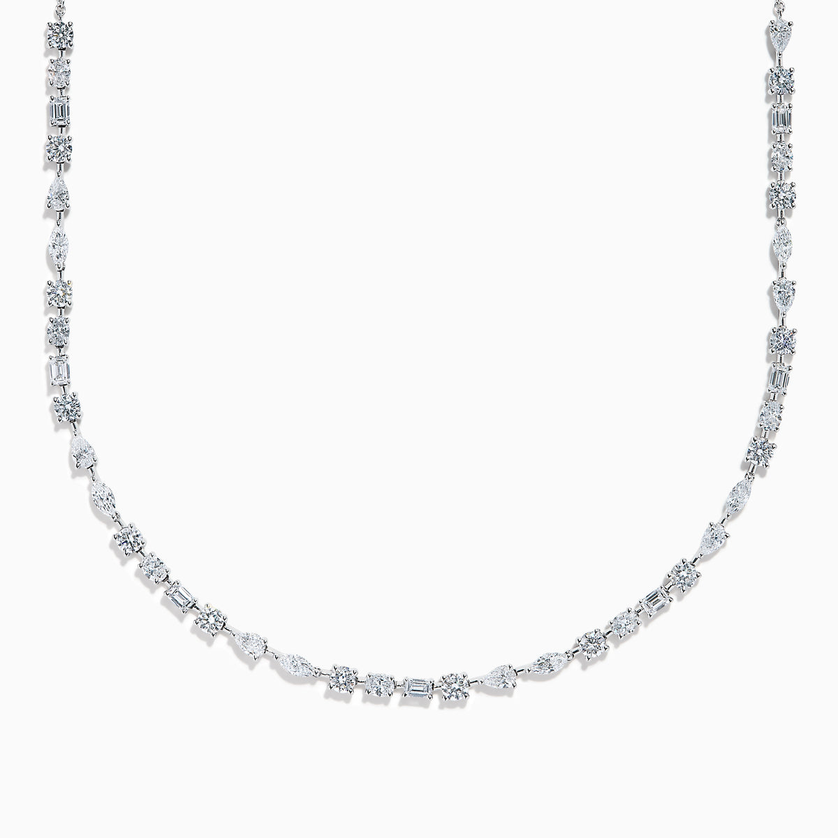 The Lab Grown Multi Shape Diamond 7.25ct Tennis Necklace in 14K White Gold features round, marquise, and emerald cut lab-grown diamonds arranged evenly along the chain and is shown gracefully curved on a white background.