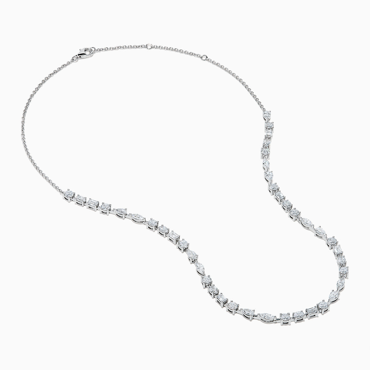 The Lab Grown Multi Shape Diamond 7.25ct Tennis Necklace in 14K White Gold features round, marquise, and emerald cut lab-grown diamonds arranged evenly along the chain and is shown gracefully curved on a white background.