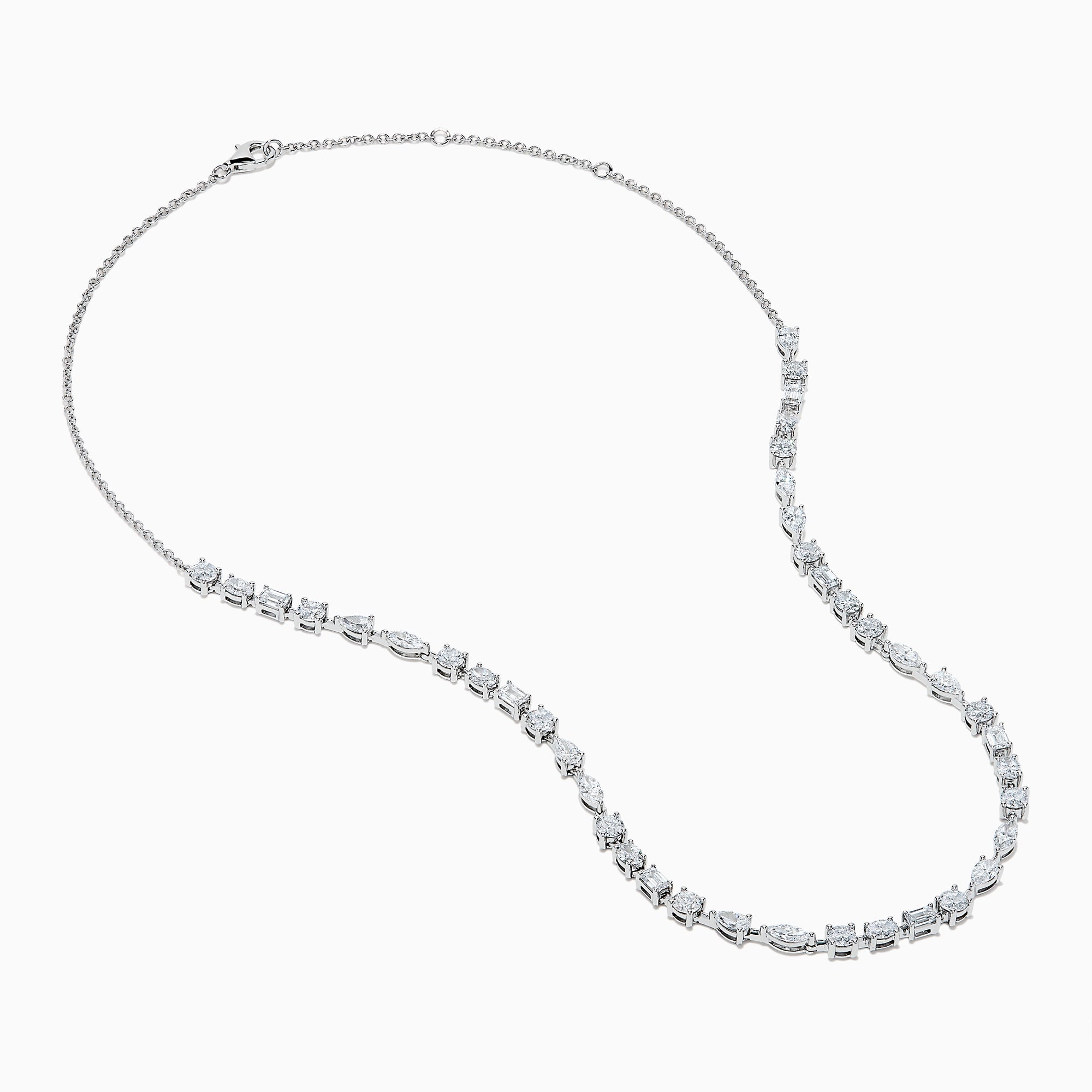 The Lab Grown Multi Shape Diamond 7.25ct Tennis Necklace in 14K White Gold features round, marquise, and emerald cut lab-grown diamonds arranged evenly along the chain and is shown gracefully curved on a white background.