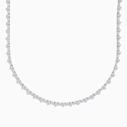 The Lab Grown Diamond Tennis Necklace in 14K White Gold showcases a continuous row of closely set round lab grown diamonds, elegantly displayed on a plain white background.