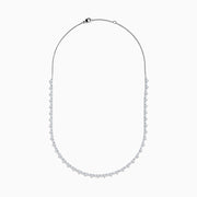 The Lab Grown Diamond Tennis Necklace in 14K White Gold showcases a continuous row of closely set round lab grown diamonds, elegantly displayed on a plain white background.