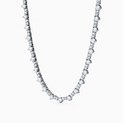 The Lab Grown Diamond Tennis Necklace in 14K White Gold showcases a continuous row of closely set round lab grown diamonds, elegantly displayed on a plain white background.