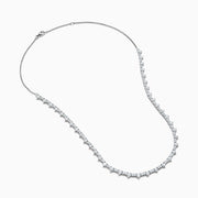 The Lab Grown Diamond Tennis Necklace in 14K White Gold showcases a continuous row of closely set round lab grown diamonds, elegantly displayed on a plain white background.