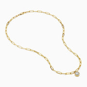 The Lab Grown Round Bezel-Set Diamond Paperclip Chain Necklace in 14K Yellow Gold features elongated oval links and a round, clear lab grown diamond pendant, shown against a white background.