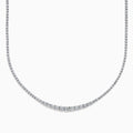 The Lab Grown Round Diamond 5.00ct Graduated Tennis Necklace in 14K White Gold features sparkling round diamonds in a slender white gold chain, displayed elegantly against a white background.