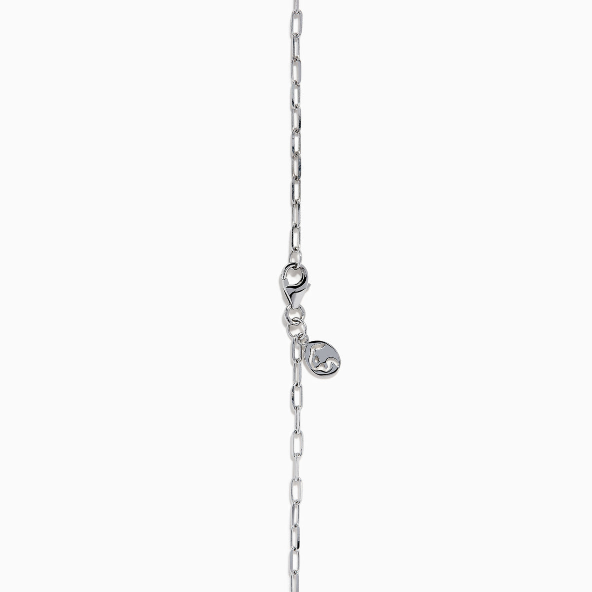 The Lab Grown Diamond Lariat Tennis Necklace in 14K White Gold showcases alternating round and rectangular lab grown diamonds, ending with a pear-shaped drop for an elegant, symmetrical look.