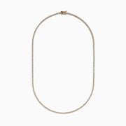 The Lab Grown Diamond 4.9ct Tennis Necklace in 14K Yellow Gold features small, evenly spaced lab grown diamonds in a continuous sparkling line, shown against a plain white background.