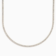 The Lab Grown Diamond 9.8ct Tennis Necklace in 14K Yellow Gold features a single row of round lab grown diamonds set closely together in an elegant line, shown on a plain white background.