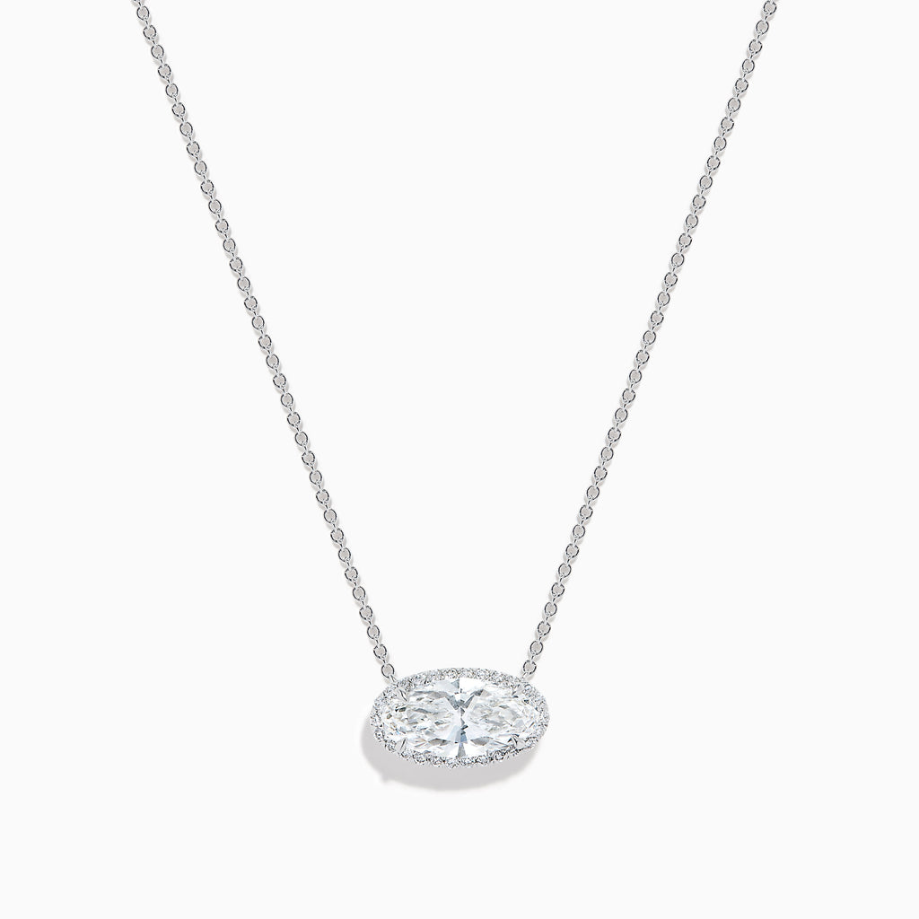 The Lab Grown Diamond East-West Oval Halo Necklace in 14K White Gold showcases a clear lab grown diamond pendant encircled by sparkling stones in an elegant halo setting.