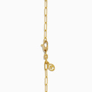 The Novelty 14K Yellow Gold Diamond Heart Lock Pendant is a yellow gold chain necklace with a diamond heart padlock, adorned with sparkling stones and a central keyhole design.