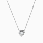 The Pave Classica 14K White Gold Diamond Heart Necklace features a heart-shaped pendant with a central diamond, surrounded by smaller diamonds, and two additional diamonds set along the chain.