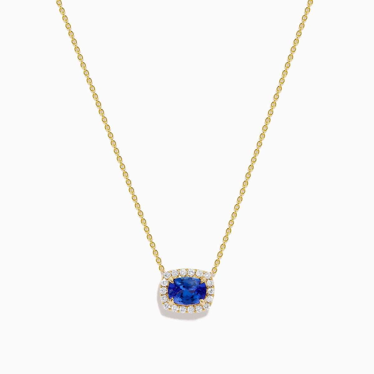 The Nahla 14K White Gold Tanzanite and Diamond Halo Necklace features a central blue oval tanzanite gemstone encircled by diamonds, shown on a white background.