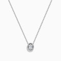 The Classique 14k White Gold Diamond Necklace by Effy features an oval pendant with a center cluster of baguette diamonds, encircled by a halo of round diamonds for a delicate, elegant look.