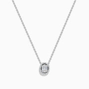 The Classique 14k White Gold Diamond Necklace by Effy features an oval pendant with a center cluster of baguette diamonds, encircled by a halo of round diamonds for a delicate, elegant look.