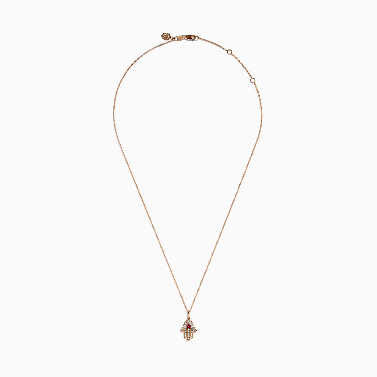 The Ruby Royale 14K Rose Gold Diamond and Ruby Hamsa Pendant features sparkling diamonds and a central ruby, showcased elegantly against a white background.
