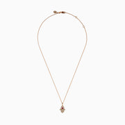 The Ruby Royale 14K Rose Gold Diamond and Ruby Hamsa Pendant features sparkling diamonds and a central ruby, showcased elegantly against a white background.
