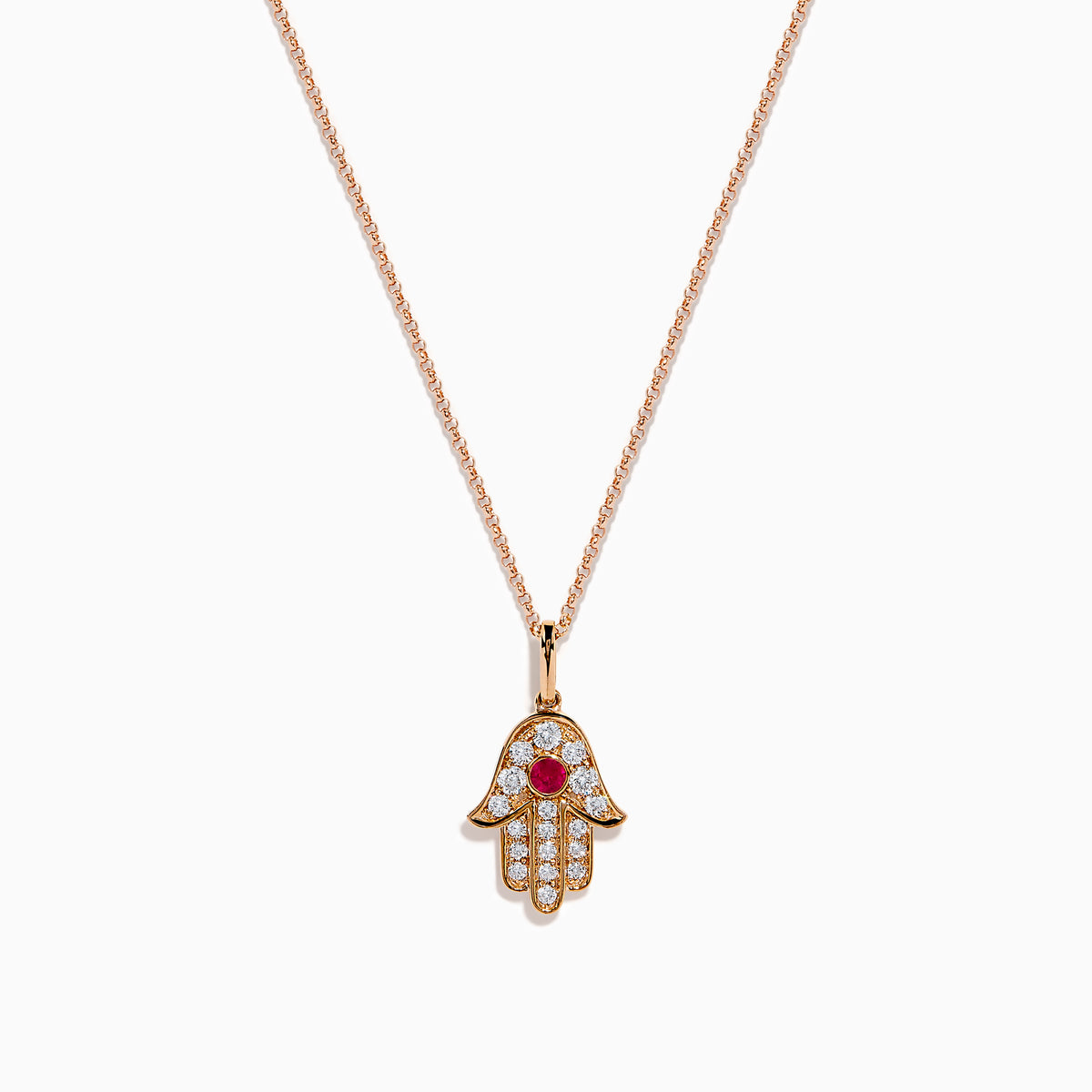 The Ruby Royale 14K Rose Gold Diamond and Ruby Hamsa Pendant features sparkling diamonds and a central ruby, showcased elegantly against a white background.