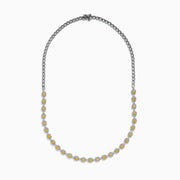 The Canare 18K Two Tone Gold White and Yellow Diamond Necklace showcases square yellow diamonds, each framed by small white diamonds, evenly set along the chain for a refined two-tone gold effect.
