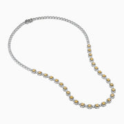 The Canare 18K Two Tone Gold White and Yellow Diamond Necklace showcases square yellow diamonds, each framed by small white diamonds, evenly set along the chain for a refined two-tone gold effect.
