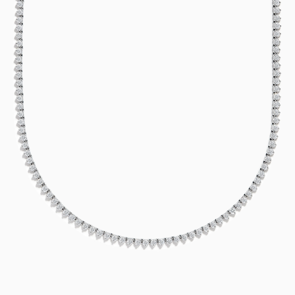 The Pave Classica 14K White Gold Diamond Tennis Necklace 6.81 TCW features evenly spaced round diamonds in a gentle curve, offering a sparkling, elegant look against a plain white background.