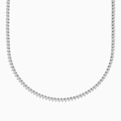 The Pave Classica 14K White Gold Diamond Tennis Necklace 6.81 TCW features evenly spaced round diamonds in a gentle curve, offering a sparkling, elegant look against a plain white background.