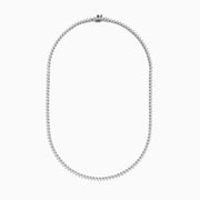 The Pave Classica 14K White Gold Diamond Tennis Necklace 6.81 TCW features evenly spaced round diamonds in a gentle curve, offering a sparkling, elegant look against a plain white background.