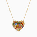 Watercolors 14K Yellow Gold Multi Sapphire Openwork Heart Pendant featuring vibrant sapphires in various shapes and sizes, hanging on a delicate gold chain against a white background.