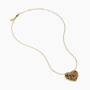 Watercolors 14K Yellow Gold Multi Sapphire Openwork Heart Pendant featuring vibrant sapphires in various shapes and sizes, hanging on a delicate gold chain against a white background.