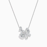 The Nature 14K White Gold Diamond Flower Necklace features sparkling diamonds in a flower-shaped pendant with intricate detailing on a fine chain, elegantly displayed on a white background.