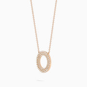 The Pave Rose 14K Rose Gold Diamond Circle Necklace showcases a circular pendant with two concentric rows of sparkling diamonds, shown on a white background.