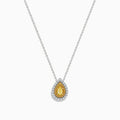 The Canare 14K Two-Tone Gold Pendant showcases a pear-shaped yellow diamond, accented with a halo of white diamonds, hanging from a delicate silver chain.