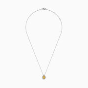 The Canare 14K Two-Tone Gold Pendant showcases a pear-shaped yellow diamond, accented with a halo of white diamonds, hanging from a delicate silver chain.