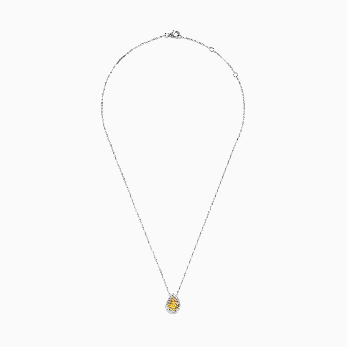 The Canare 14K Two-Tone Gold Pendant showcases a pear-shaped yellow diamond, accented with a halo of white diamonds, hanging from a delicate silver chain.
