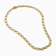 The 14K Yellow Gold Chain Link Necklace with Diamond Accents features oval links joined by sections set with clear diamonds, forming a symmetrical, elegant design.