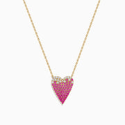 The 14K Yellow Gold Pink Sapphire and Diamond Heart Necklace features a heart-shaped pendant with pink sapphires and diamonds in a gradient design.