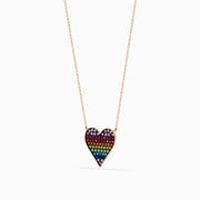 The Watercolors 14K Yellow Gold Multi Color Sapphire Heart Necklace features a gold chain and a heart-shaped pendant adorned with rainbow sapphires arranged from purple to blue.